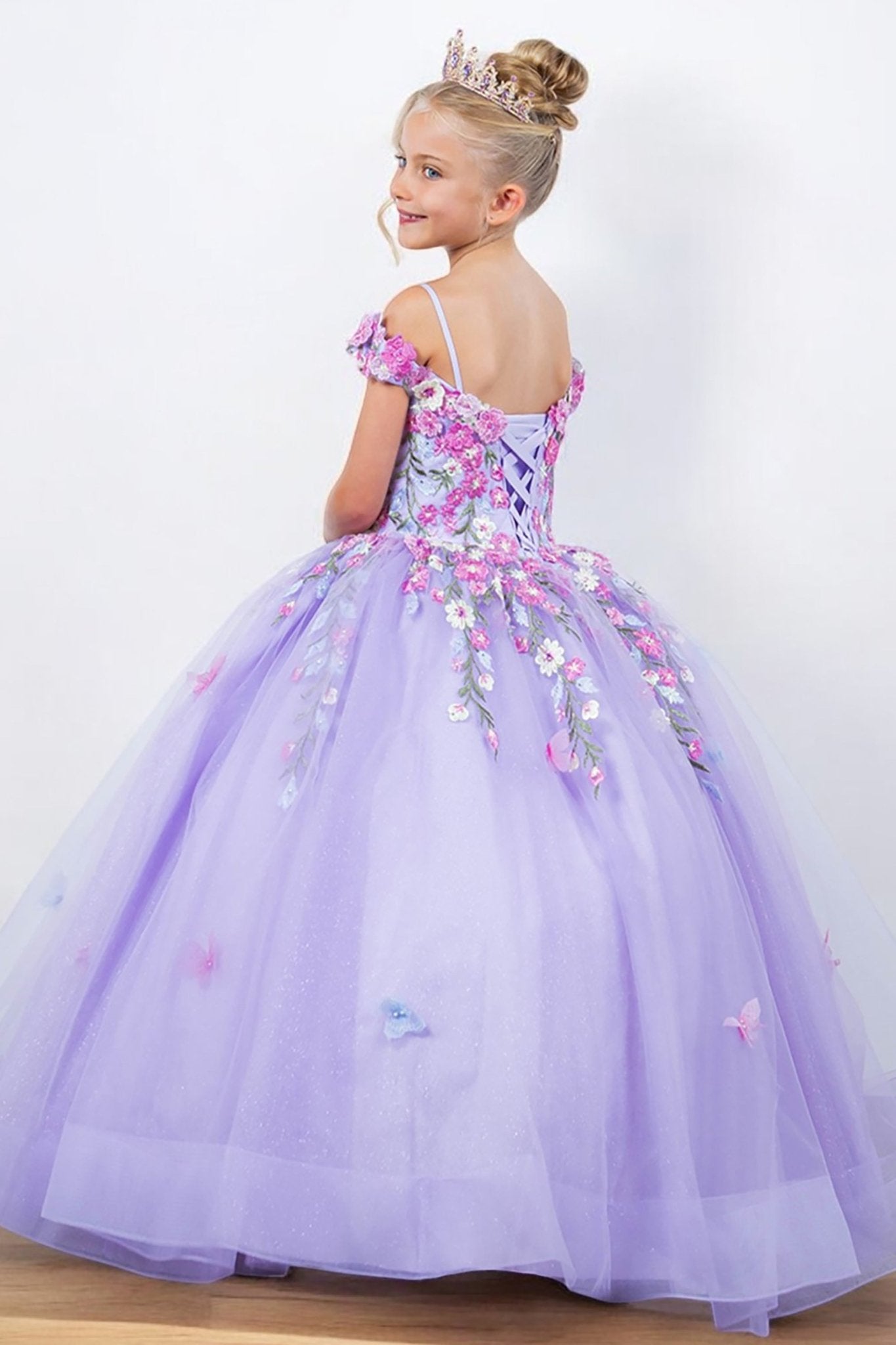 Lilac back view kids mini quinceañera mini quince dress with multicolor daisy embroidery and large detachable bow.