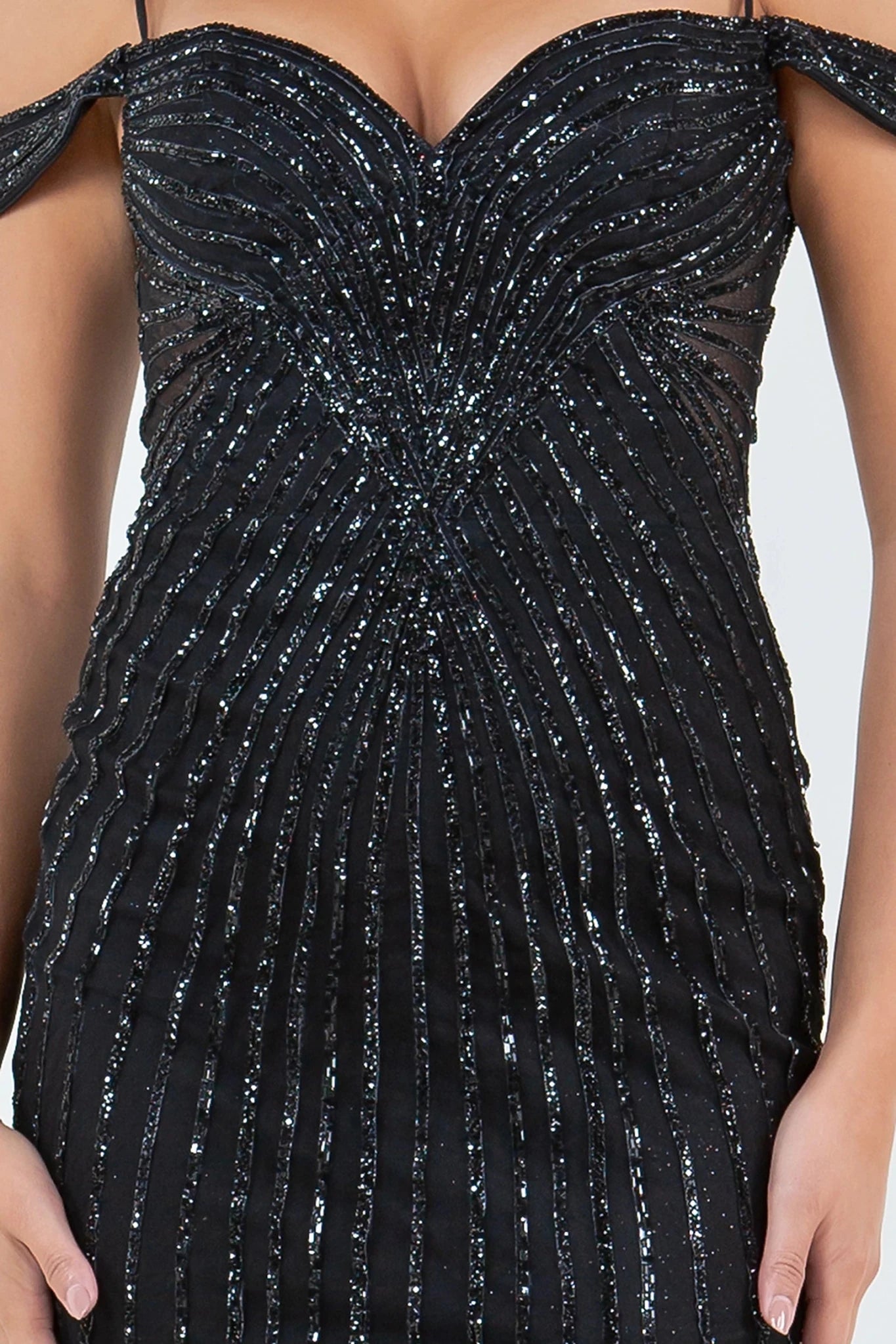 Black evening dress featuring rhinestone embellishments in vertical patterns
