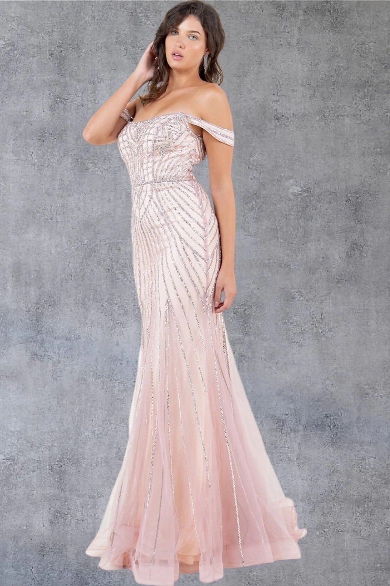 Rose gold prom dress designed with sheer tulle overlay flowing to floor length