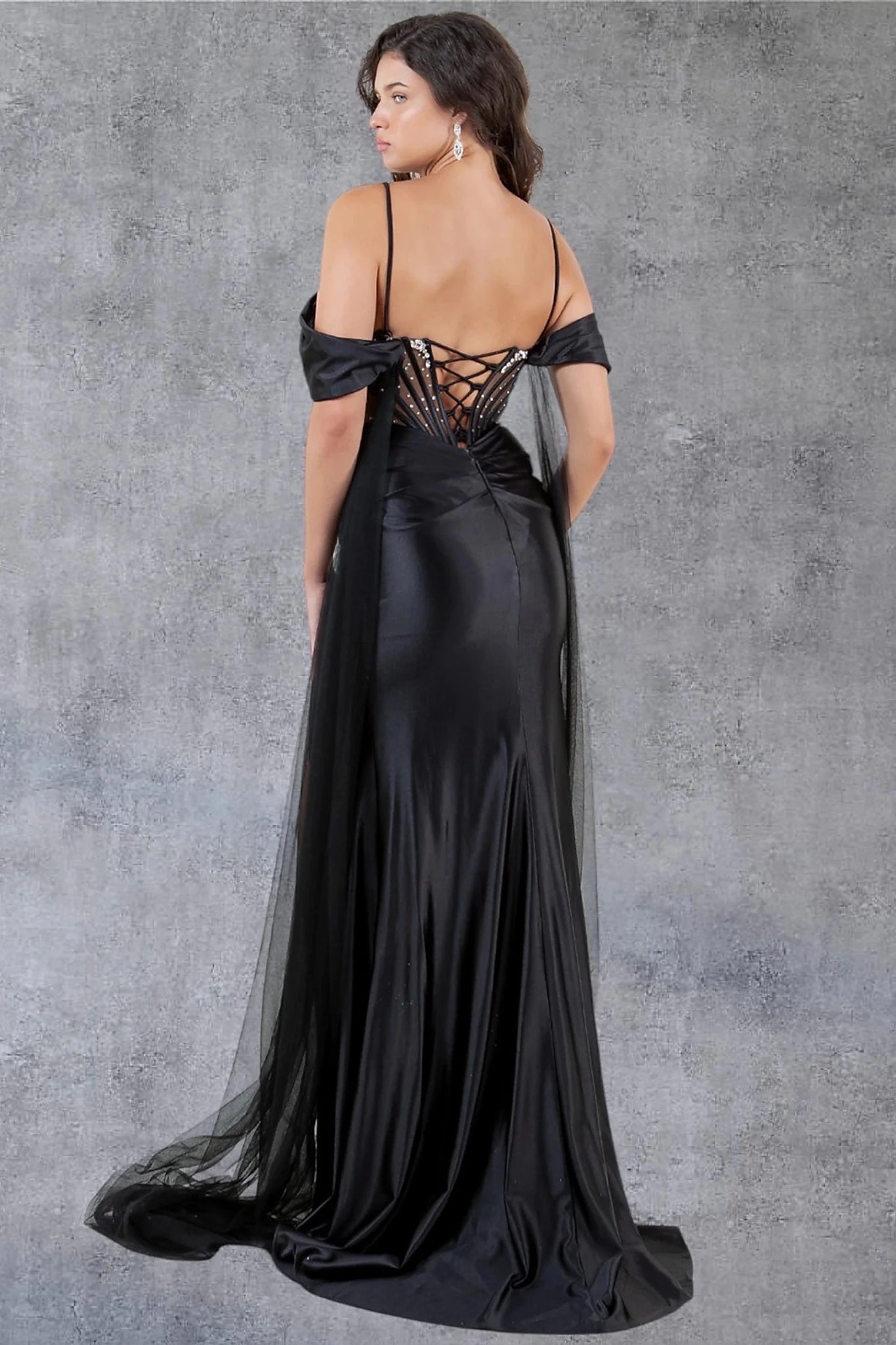 Black prom dress designed with lace-up back and zipper closure