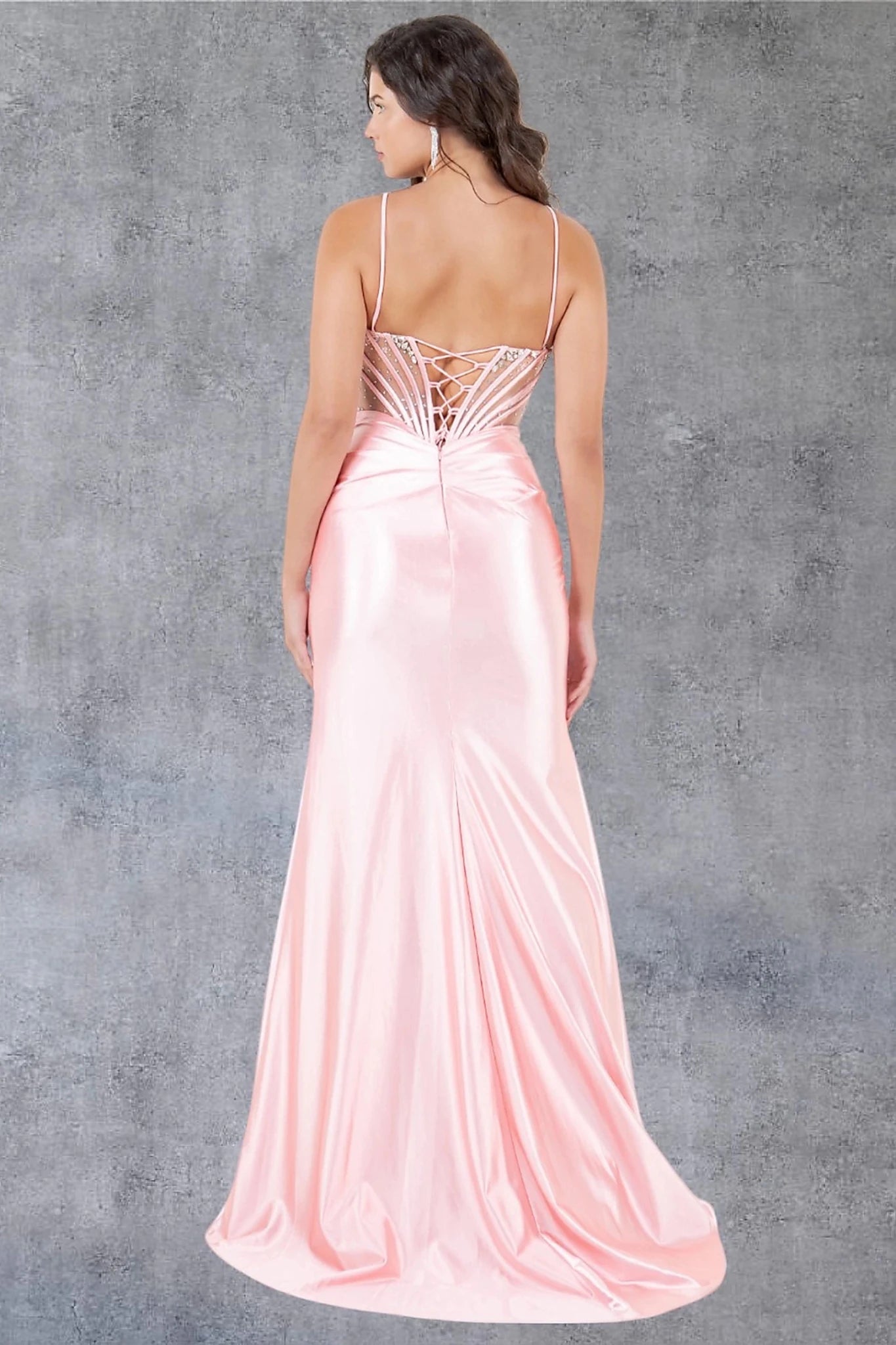 Blush prom dress designed with lace-up back and zipper closure
