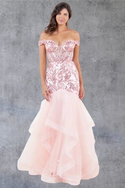 A full-length view of a woman wearing blush formal dress with a lace-up corset and layered mermaid tulle skirt.