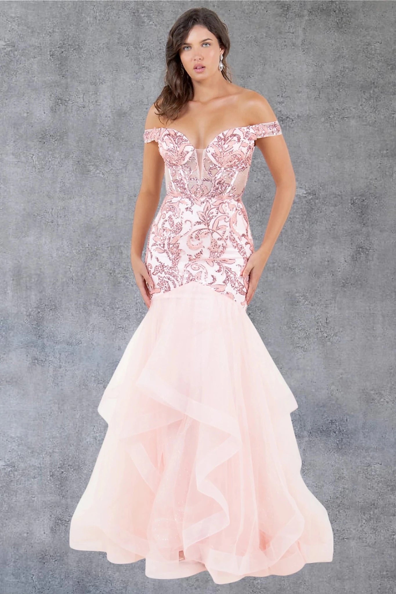 Blush evening dress styled with plunging neckline and sheer illusion mesh