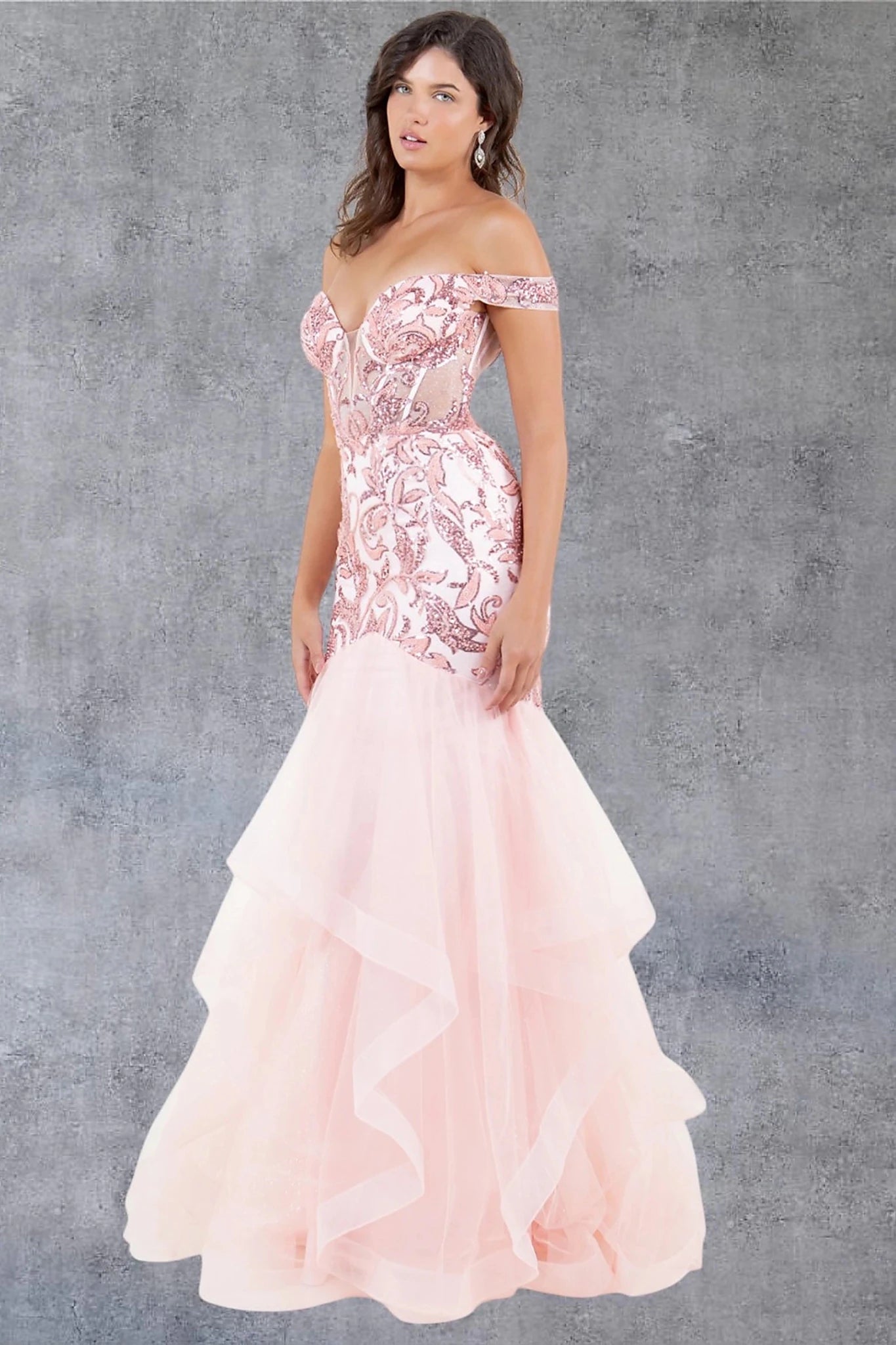 Blush evening dress showcasing layered tulle mermaid skirt with voluminous design