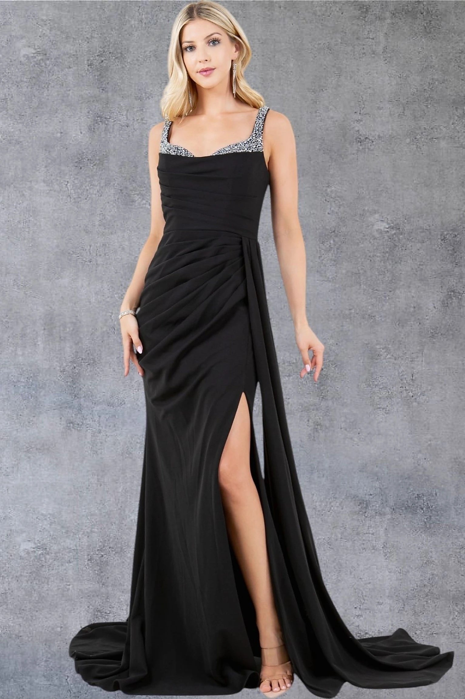 Black evening dress showcasing floor-length skirt with side drape