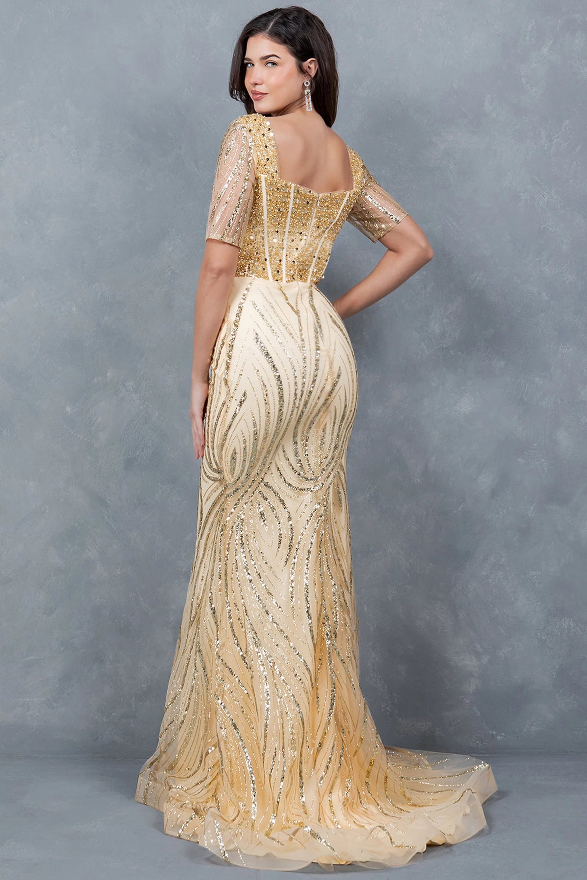 Rear view of the Champagne mother of the bride dress reveals a square back and beaded train.