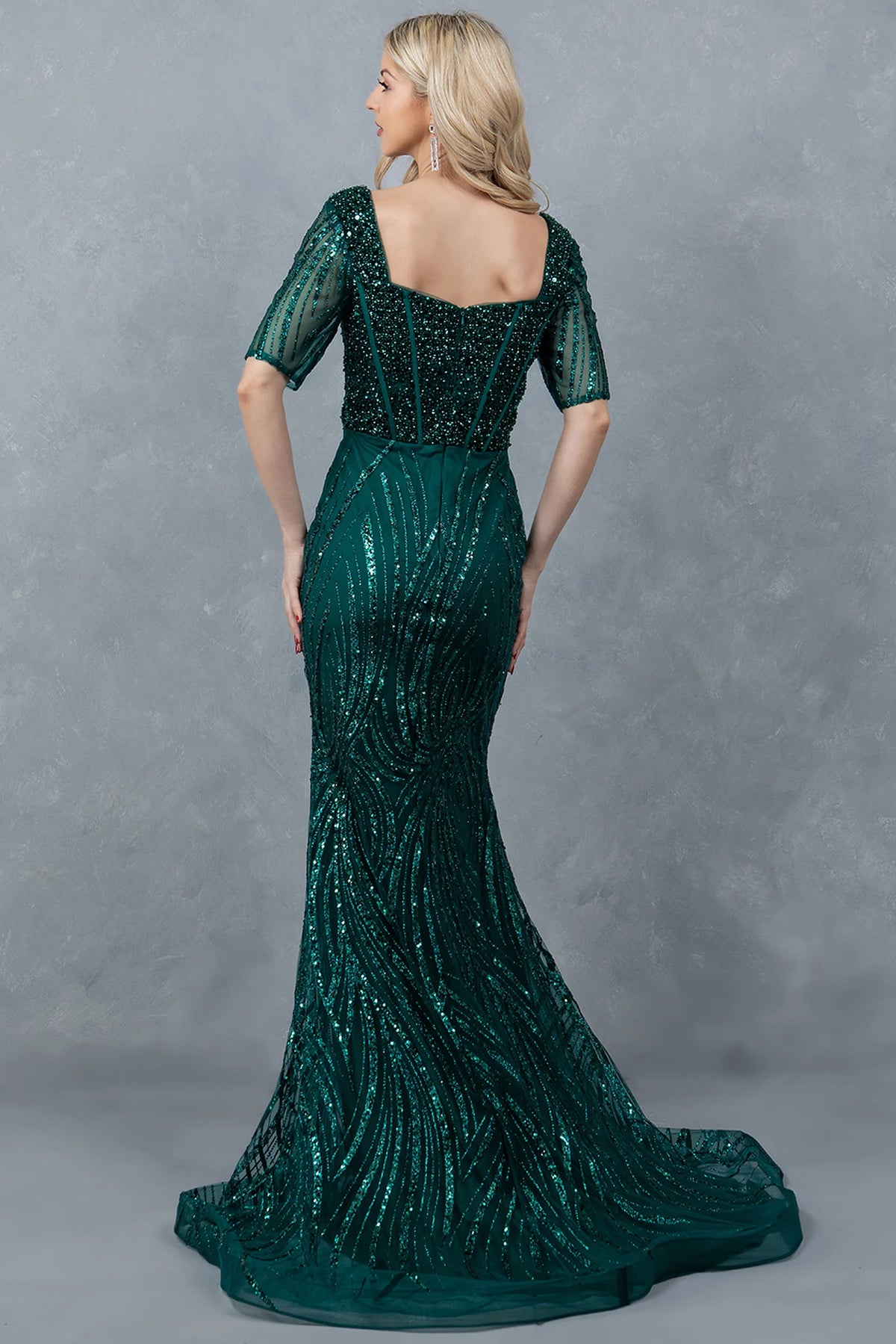 From behind, the Hunter Green mother of the bride dress shows a square back and small train.