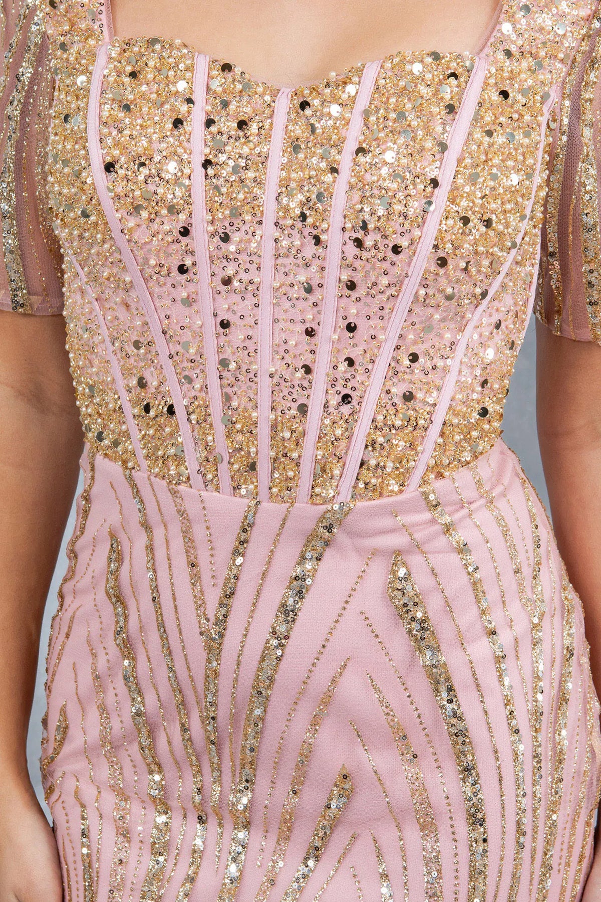 Close beadwork emphasizes the square neckline of this Rose Gold mother of the bride dress.