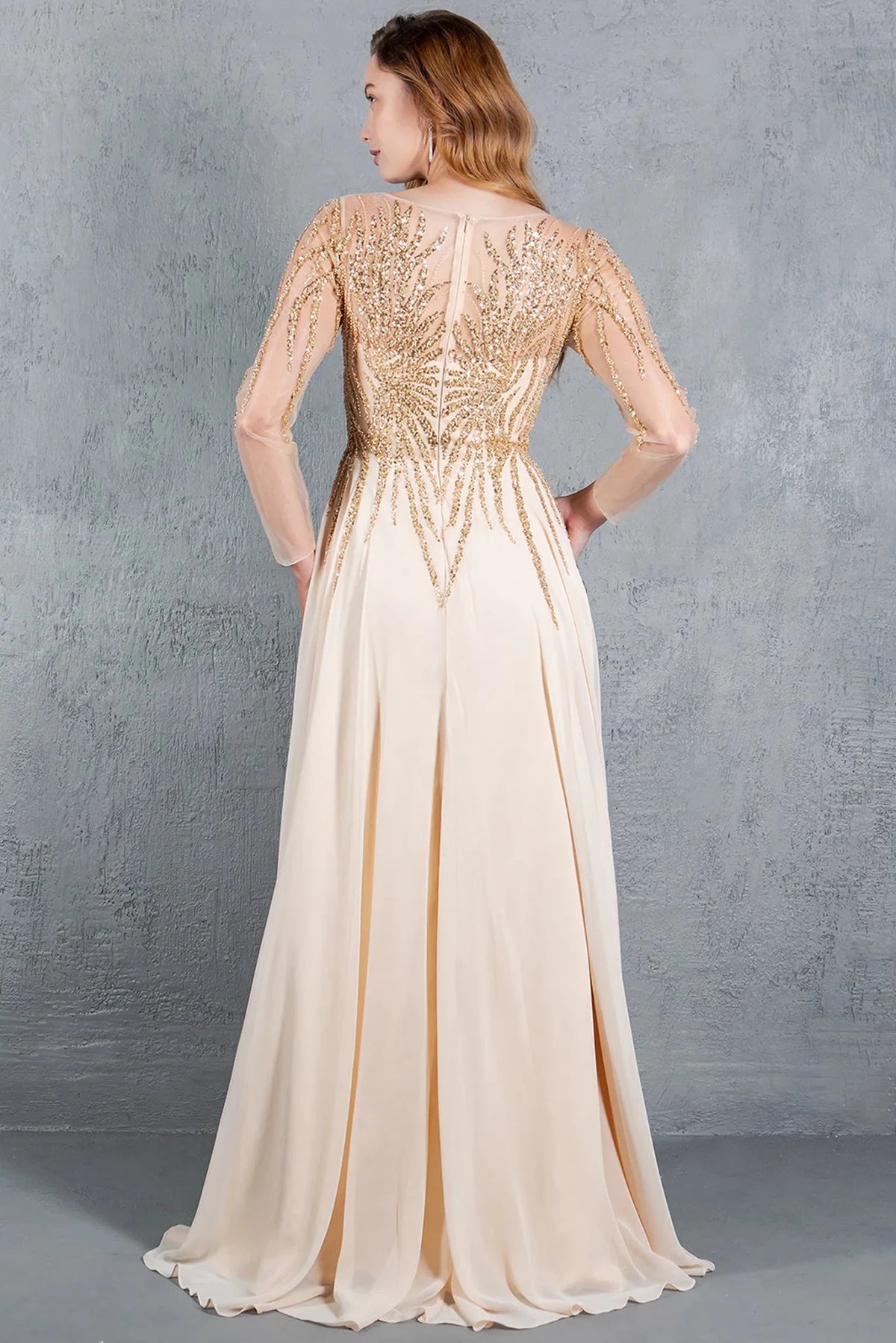 Rear detail on the Champagne mother of the bride dress shows a sheer zipper back and soft skirt.