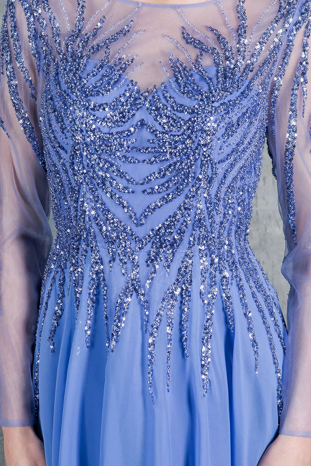 Intricate beadwork accents the illusion neckline of this Dusty Blue mother of the bride dress.
