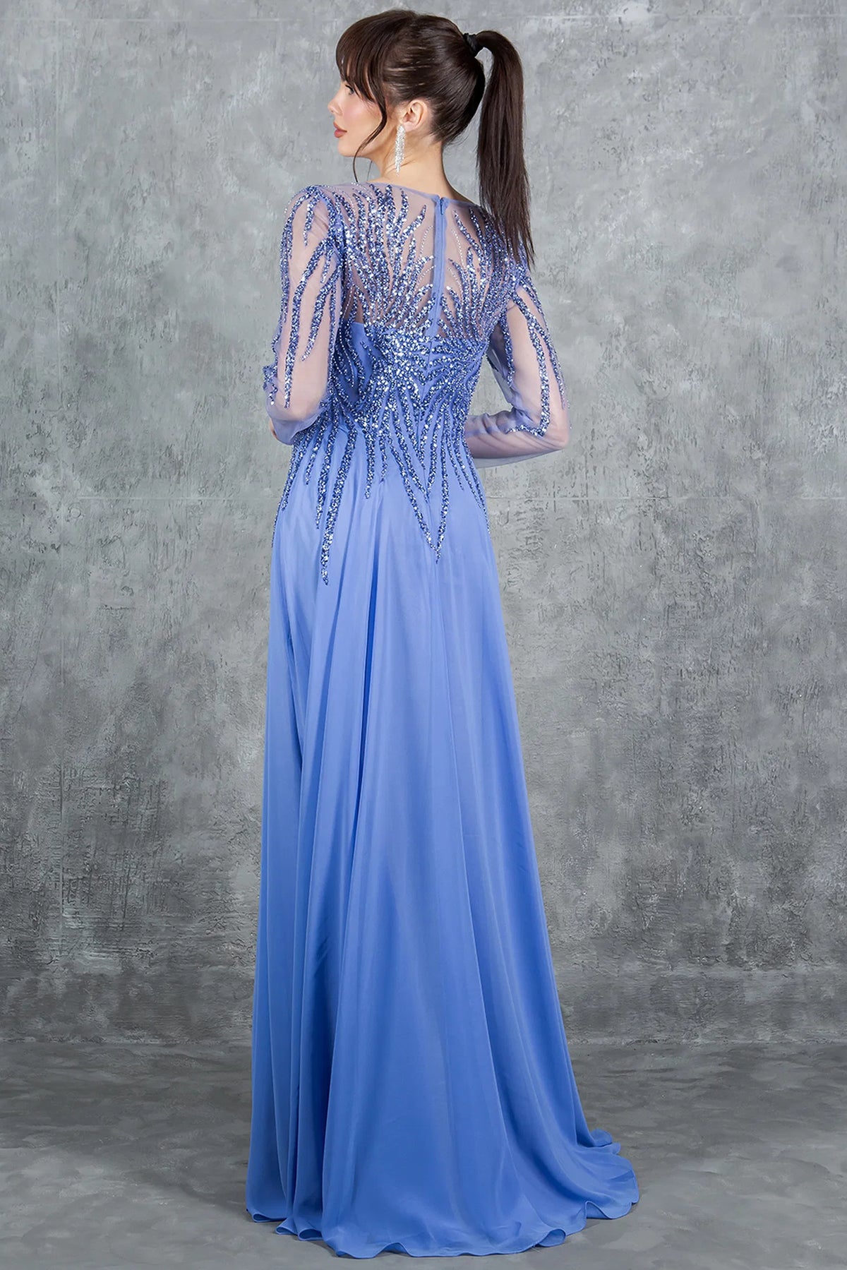 Behind the Dusty Blue mother of the bride dress, a sheer beaded back meets the chiffon skirt.
