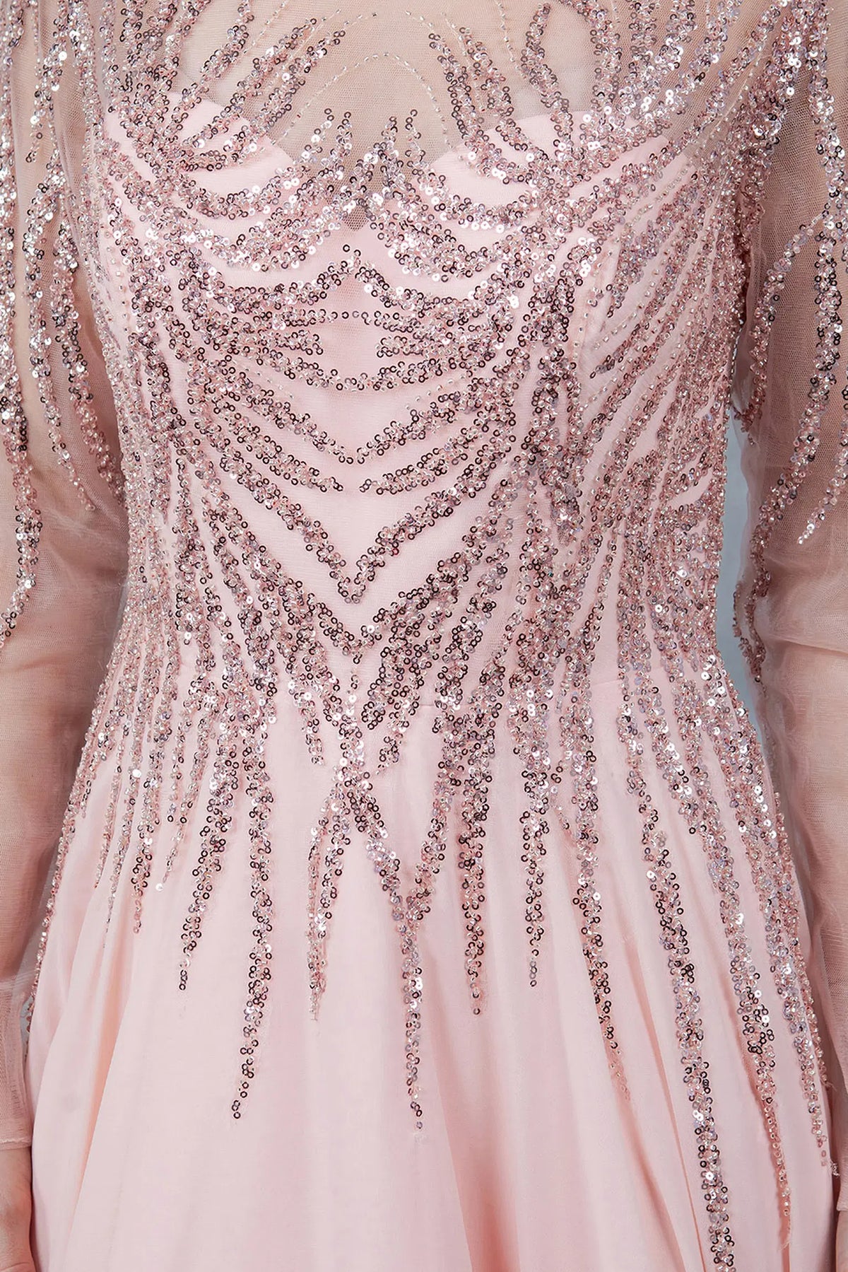Detailed Rose Gold mother of the bride dress highlights cascading sequins across the sheer bodice.
