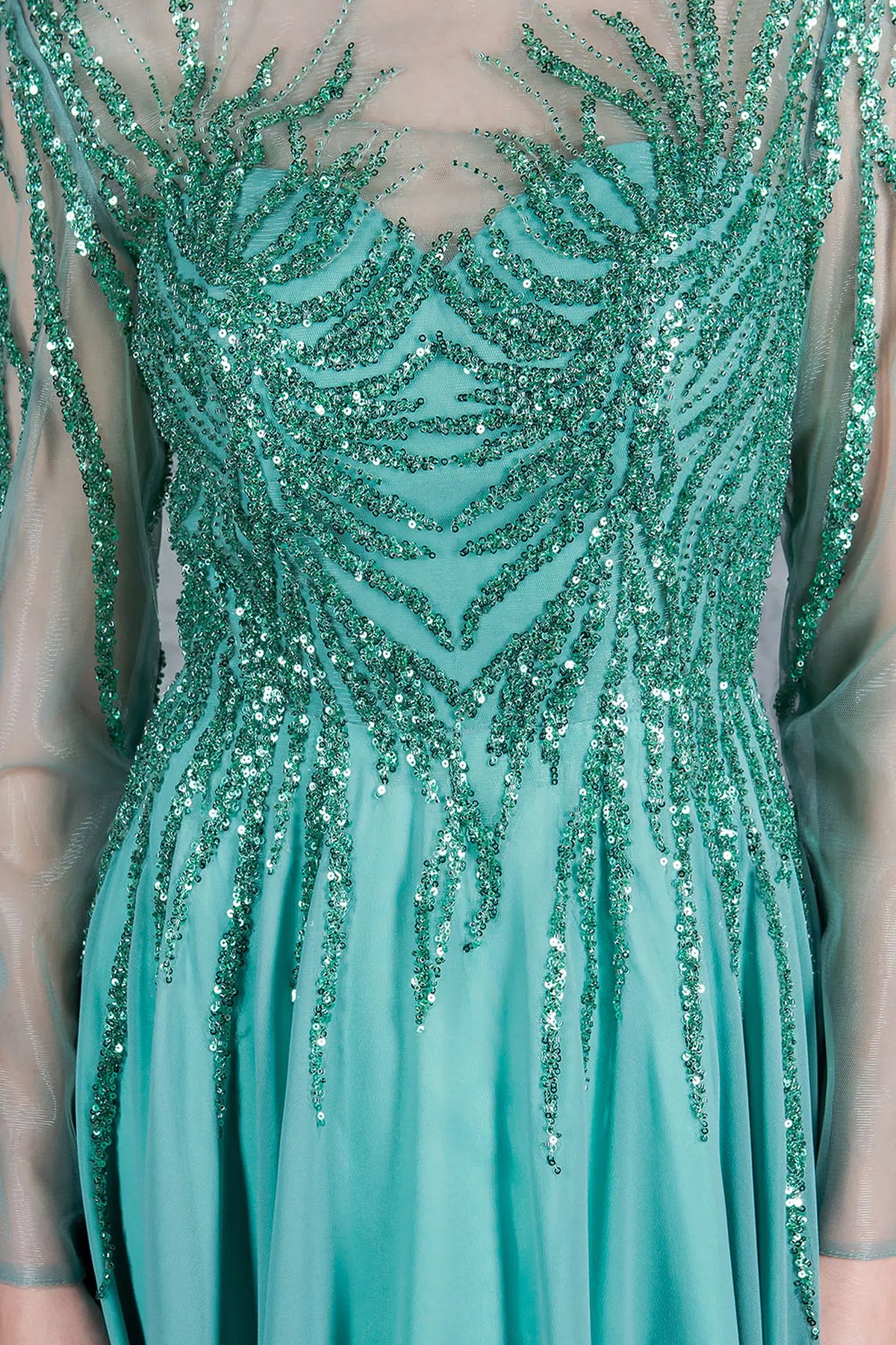 Close detailing reveals the illusion neckline and sequined bodice on this Sage mother of the bride dress.