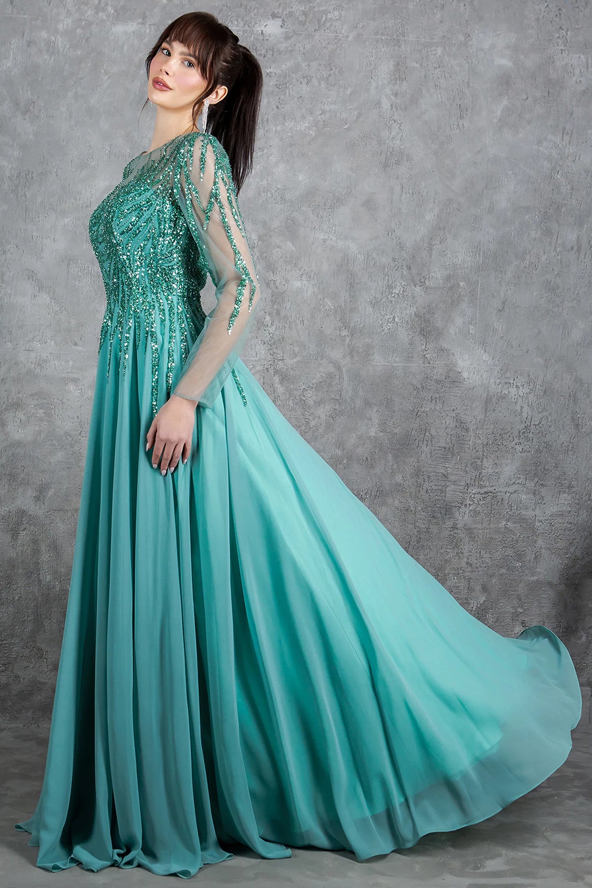 A side view gives the Sage mother of the bride dress graceful movement through its chiffon skirt.