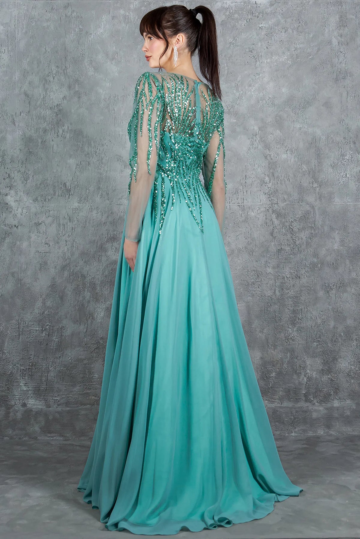 Rear styling of the Sage mother of the bride dress displays a sheer beaded zipper back.