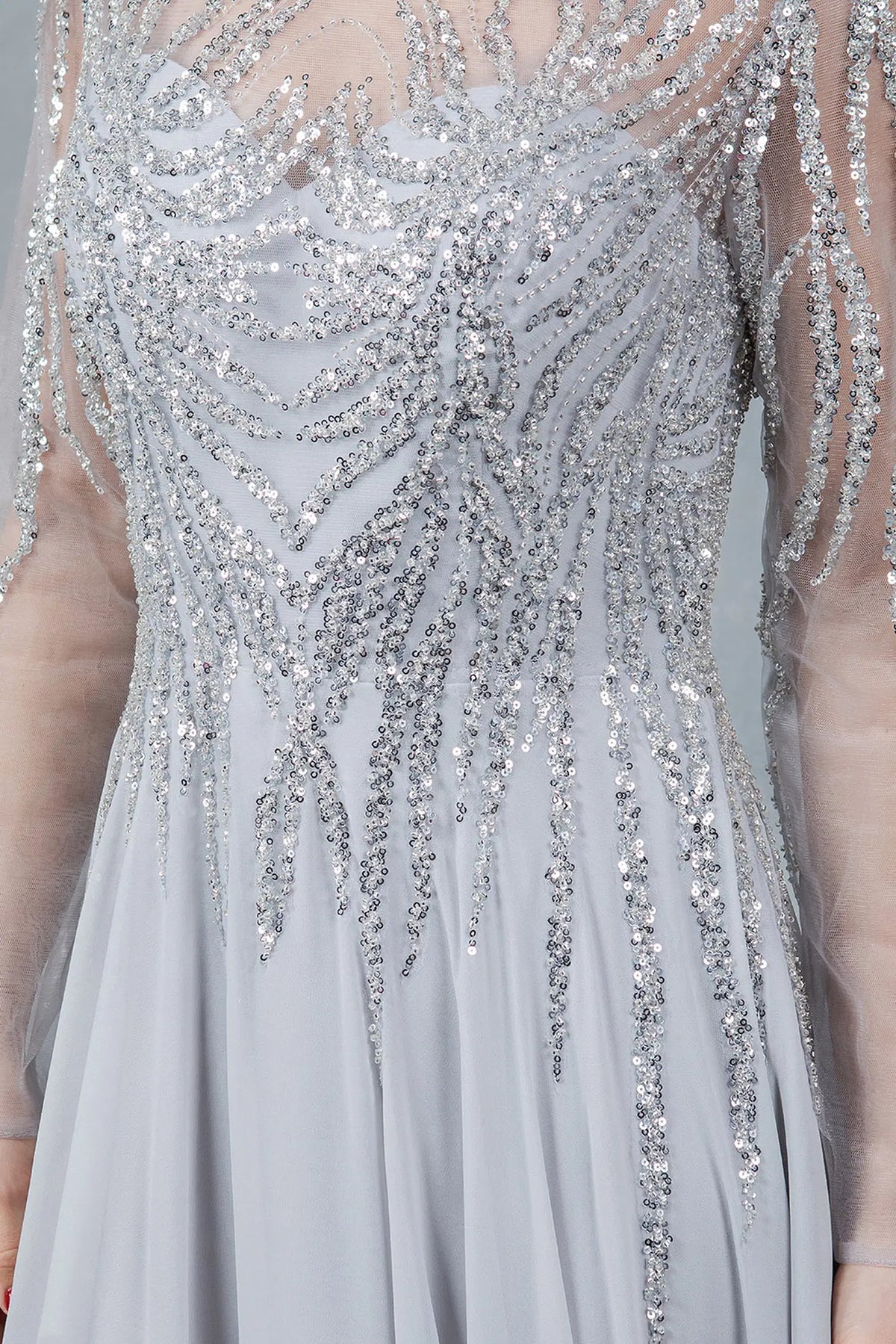 Detailed sequins frame the illusion neckline of this Silver mother of the bride dress.