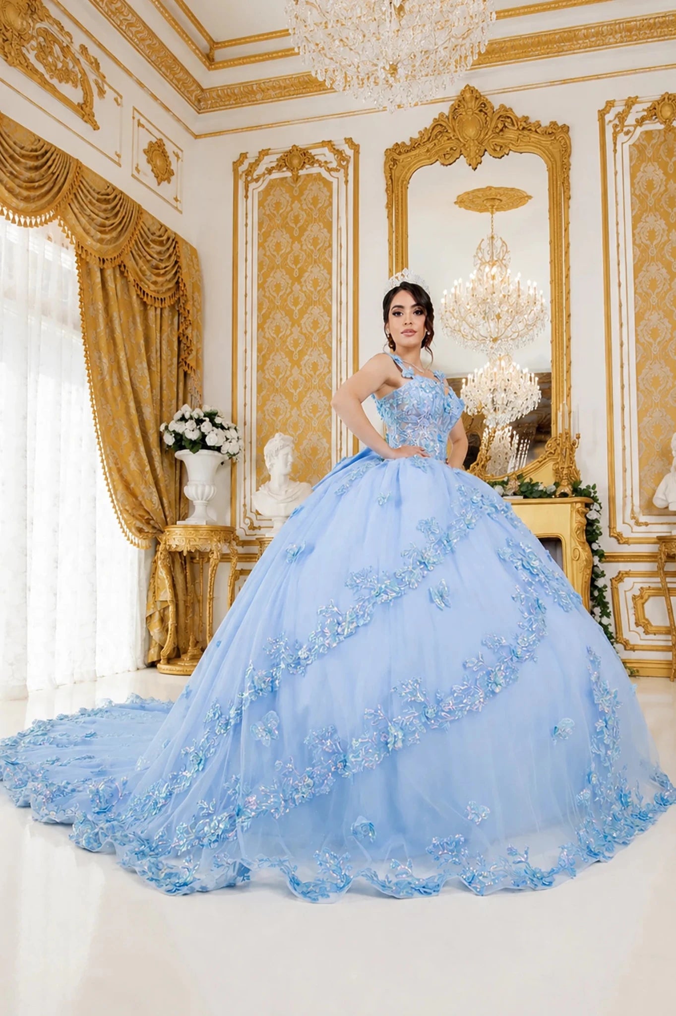 light blue quinceanera ball gown with floral appliqué and a long train