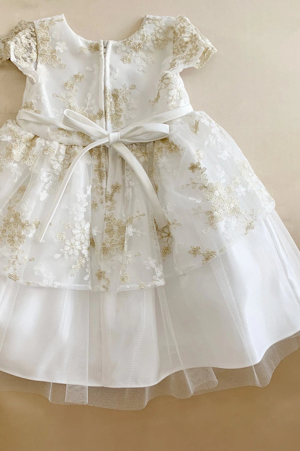 White floral flower girl dress with a belt. Also suitable as a communion dress. Also suitable as a baptism dress.