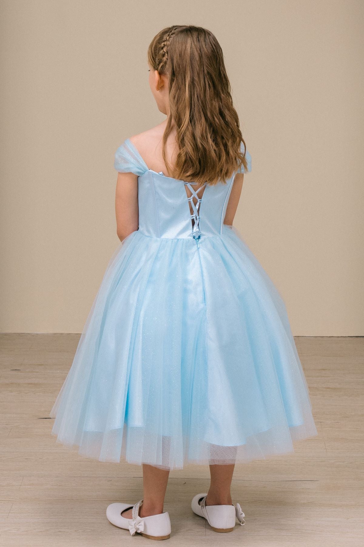 A blue lace up back flower girl dress.