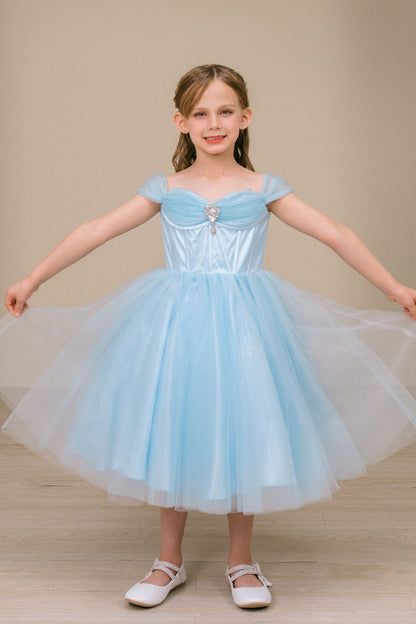 girl wearing a blue Off-Shoulder Tulle Dress on a beige background