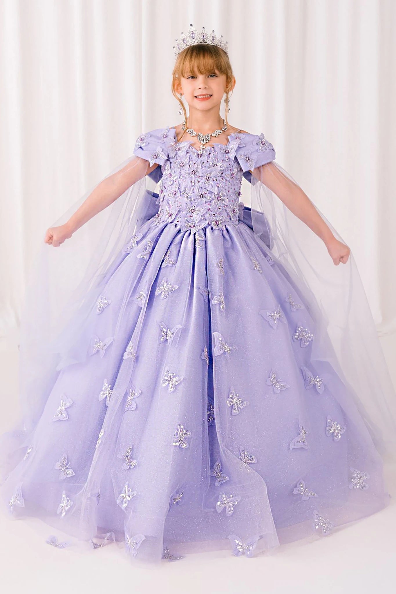 Lilac front view kids mini quinceañera mini quince dress with glitter puff sleeves, butterfly applique.