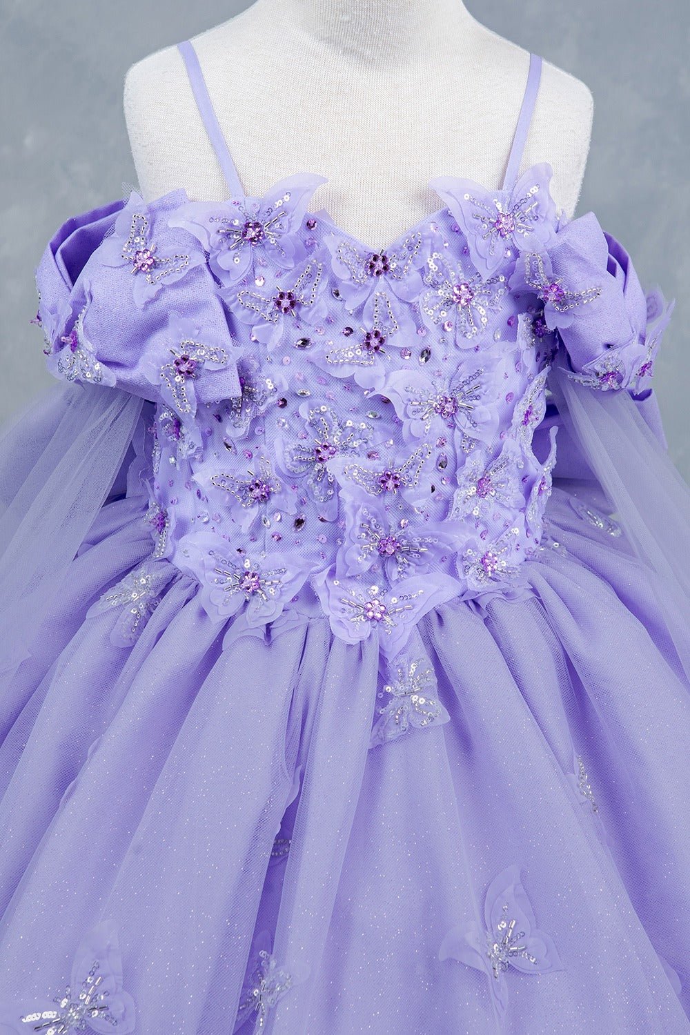 Lilac front zoom kids mini quinceañera mini quince dress with glitter puff sleeves, butterfly applique.