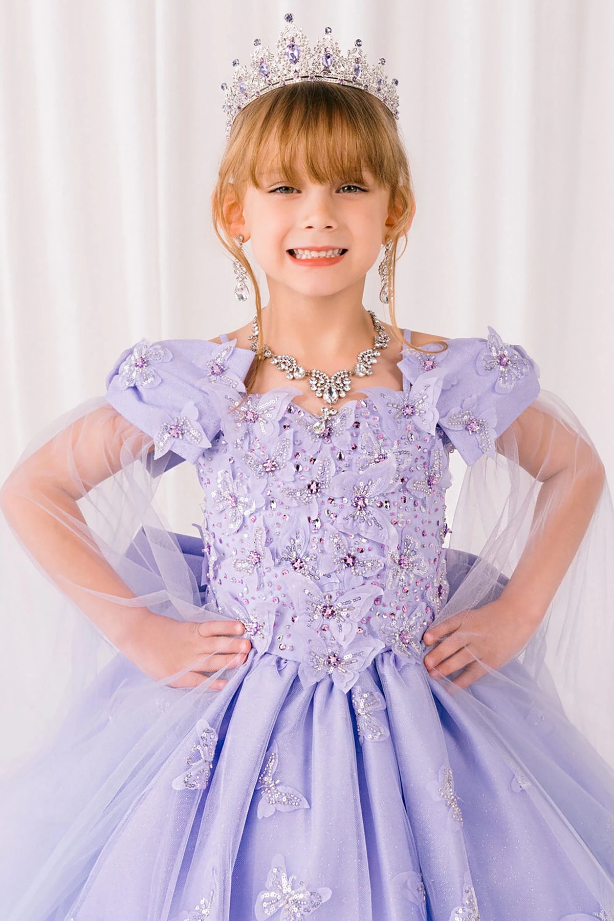 Lilac front view kids mini quinceañera mini quince dress with glitter puff sleeves.