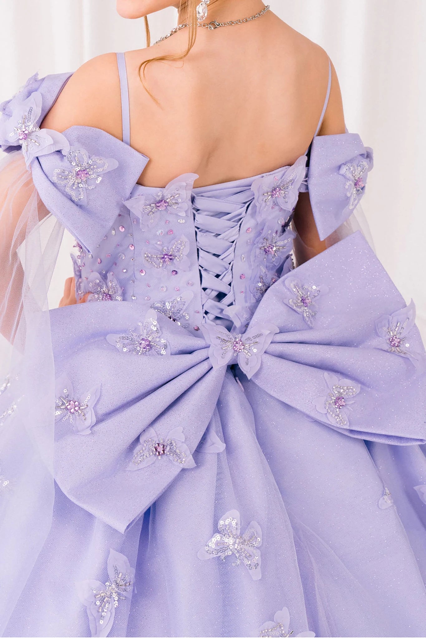 Lilac front view kids mini quinceañera mini quince dress with glitter puff sleeves, bow detail.