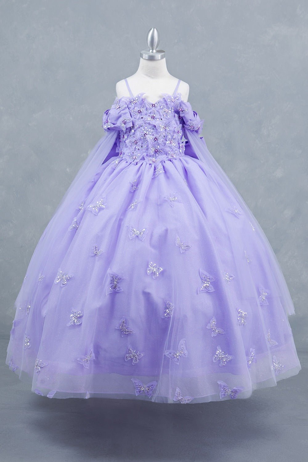 Lilac front view kids mini quinceañera mini quince dress with glitter puff sleeves, butterfly applique.
