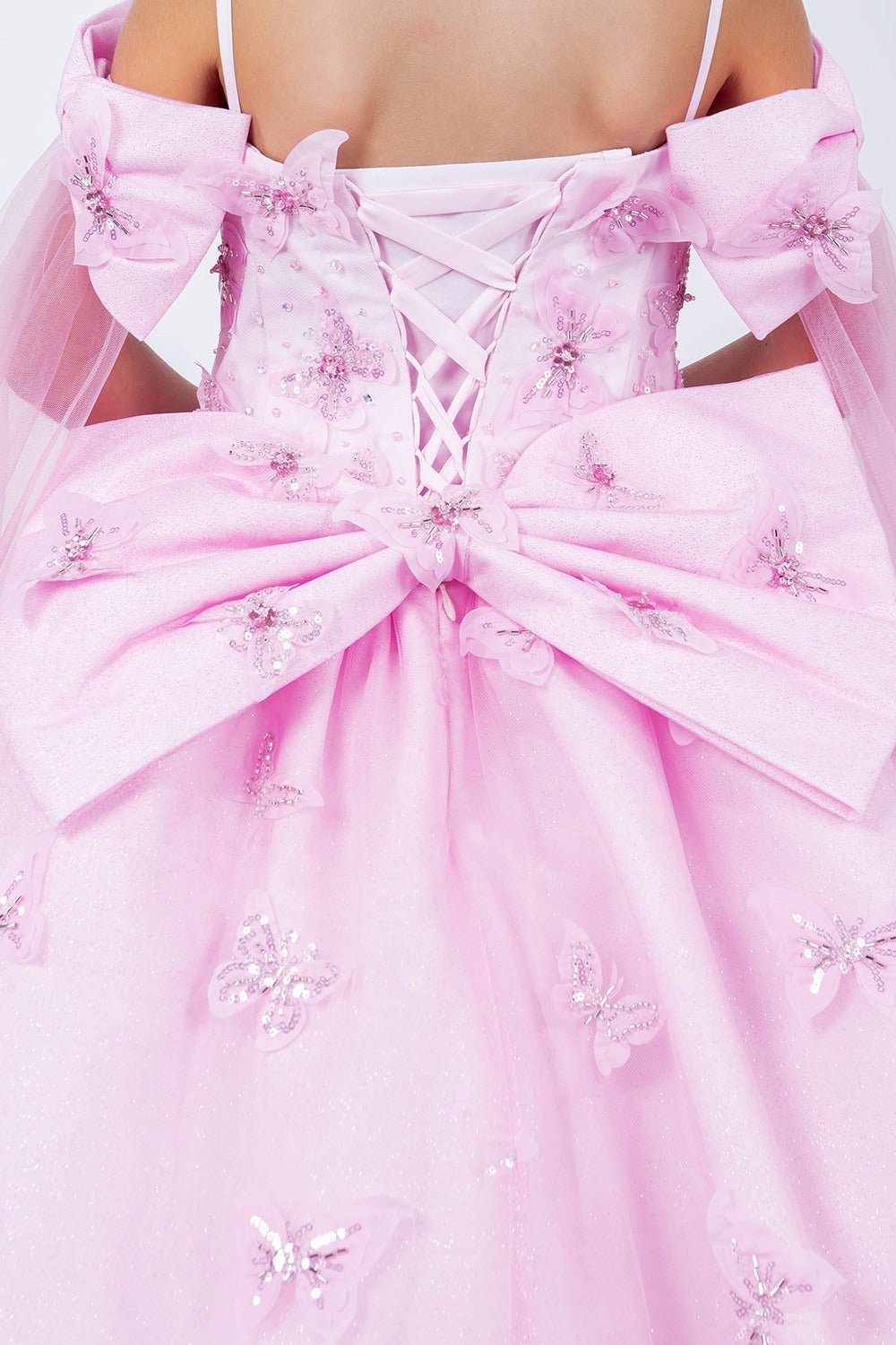 Pink back zoom kids mini quinceañera mini quince dress with glitter puff sleeves, butterfly applique.