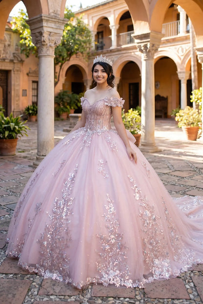 Side view of a rose gold quinceanera dress with sweetheart bodice, beadwork, 3D floral appliques, and layered shimmering tulle skirt