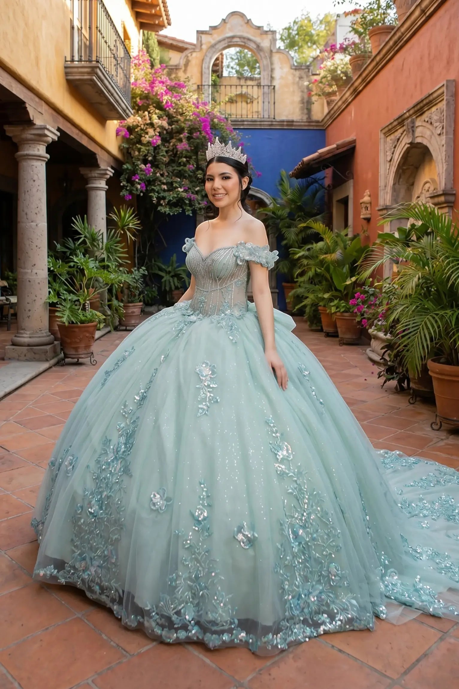Side view of a silver sage quinceanera dress with sweetheart bodice, beadwork, 3D floral appliques, and layered shimmering tulle skirt