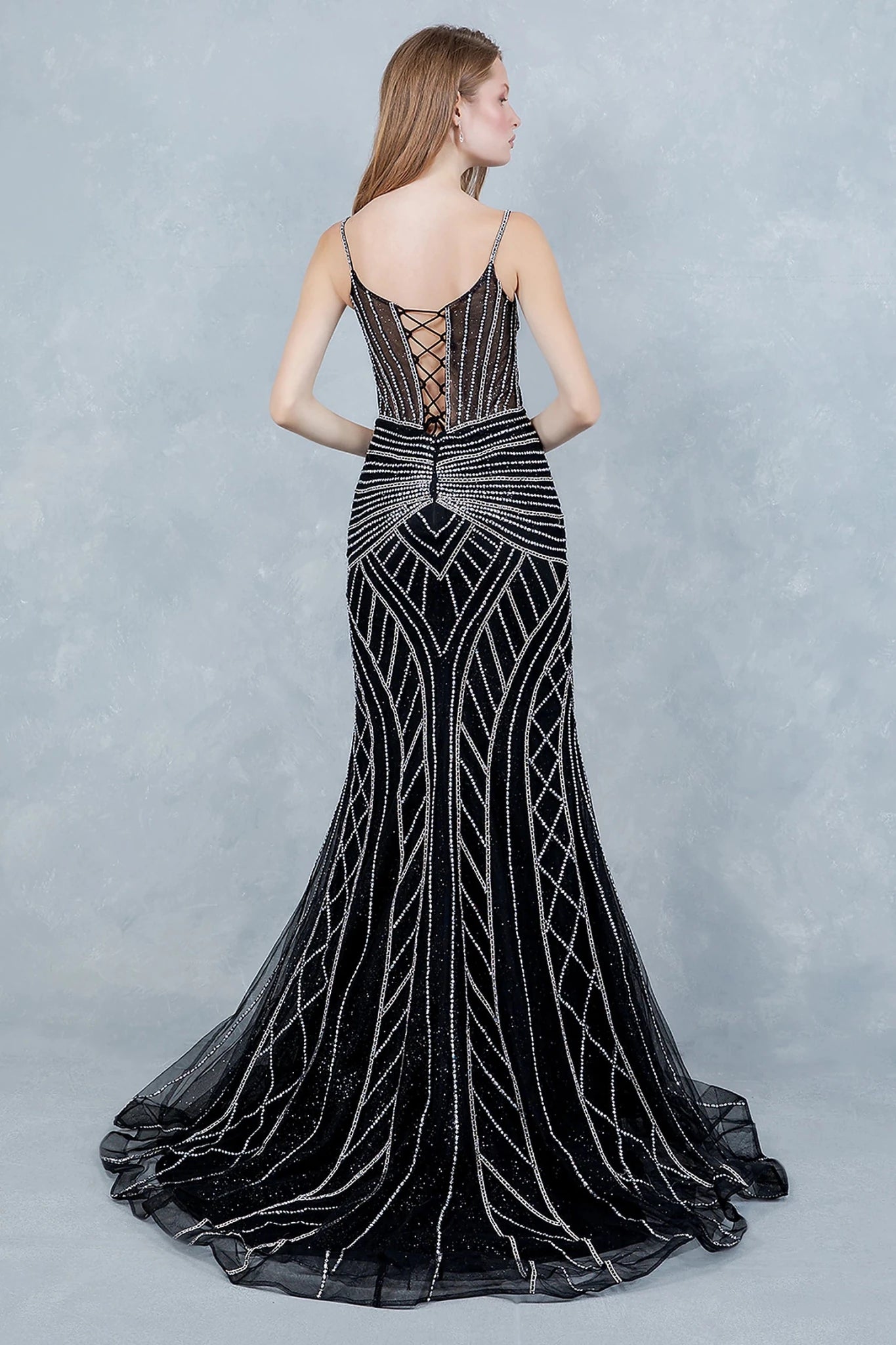 Black evening dress showcasing lace-up back closure for adjustable fit