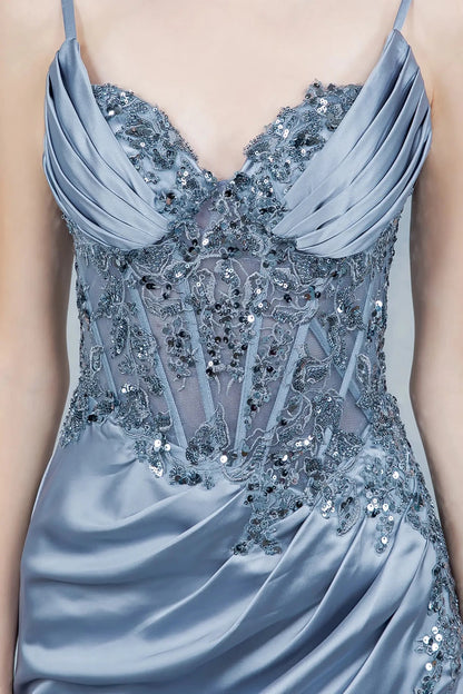 A close-up view of a woman wearing a blue lace corset bodice with sheer paneling.