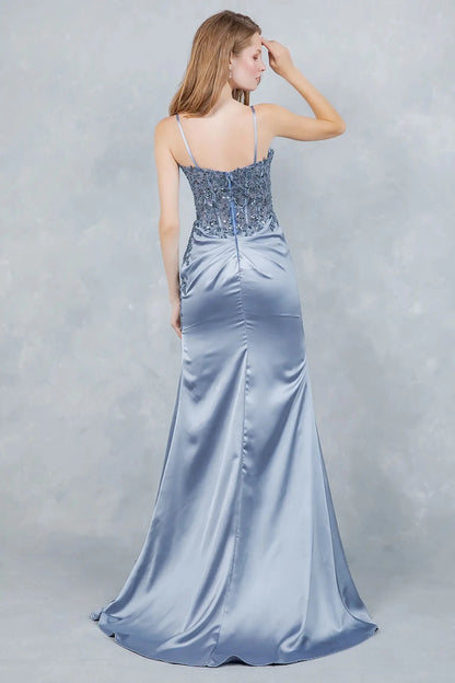 Full back view of a woman wearing a blue satin dress, highlighting its elegant silhouette.