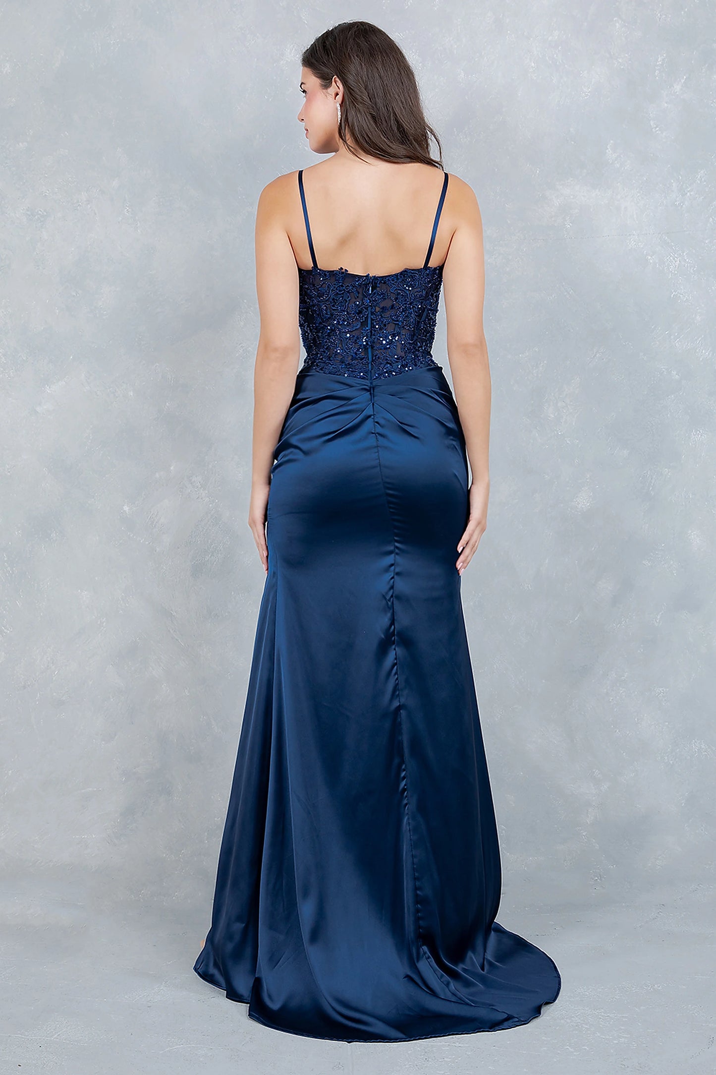 Navy prom dress designed with open back and zipper closure