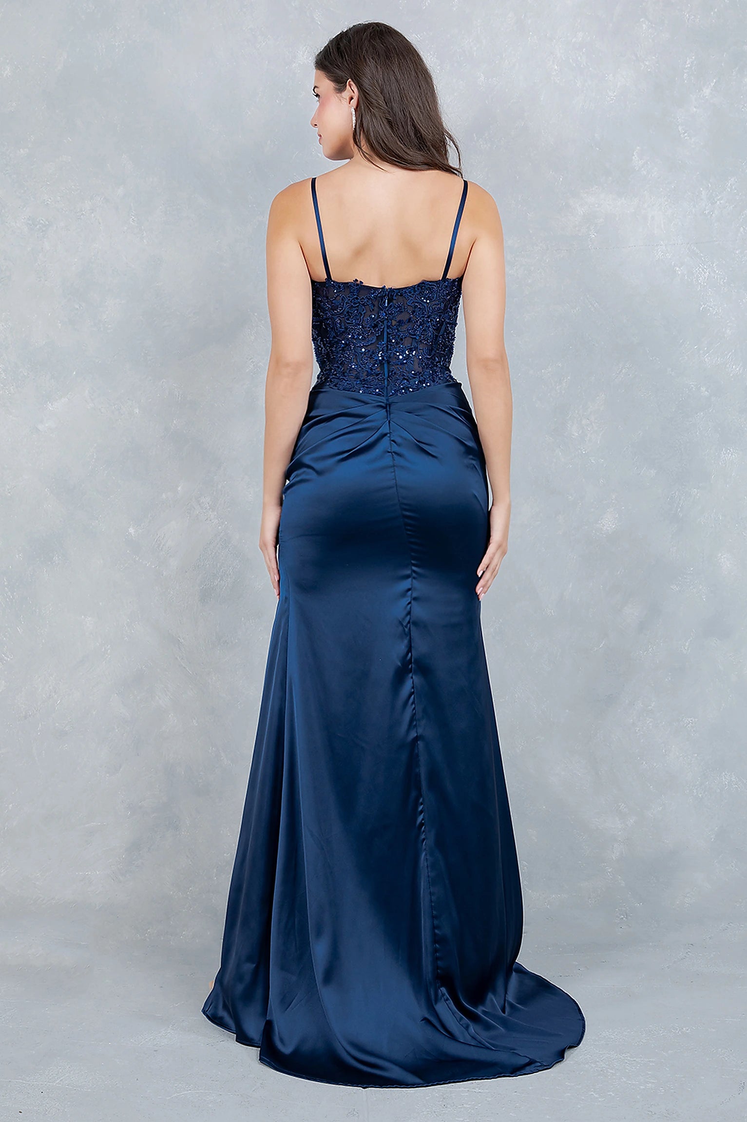Navy prom dress designed with open back and zipper closure