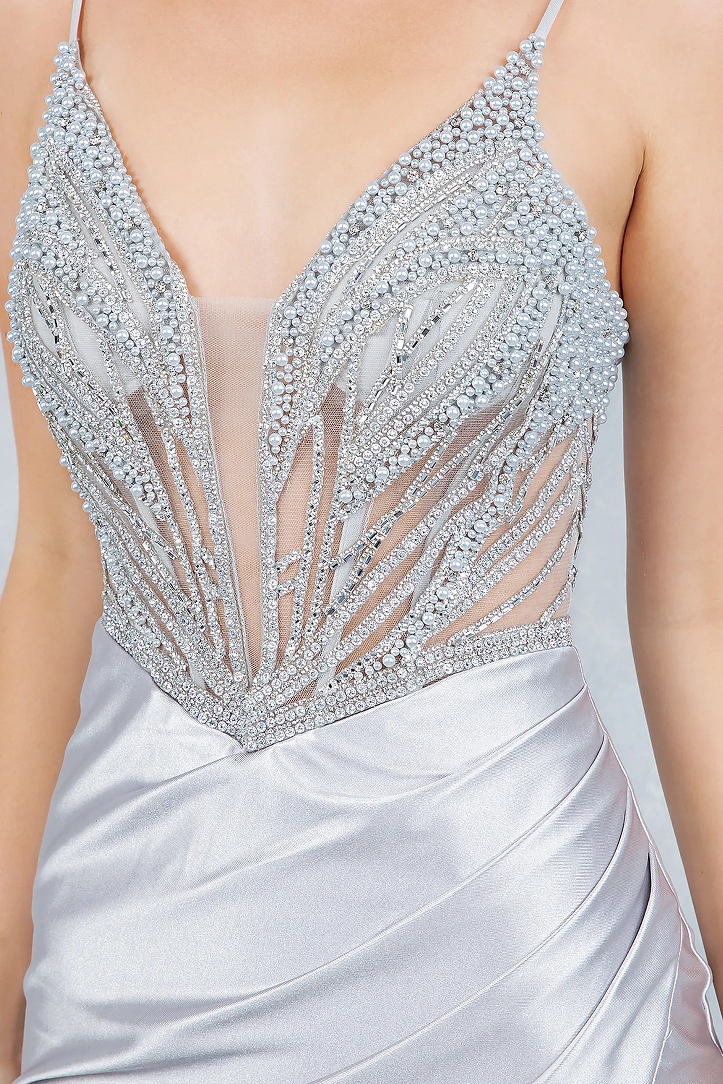Silver satin mermaid prom dress featuring bodice with beadwork rhinestones and pearls