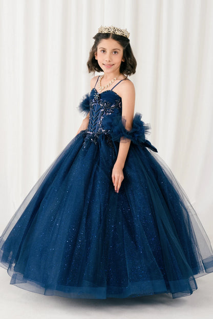 Displayed in a angled view, the Navy mini quince dress has beaded bodice and sheer puff sleeves above a full ball skirt.