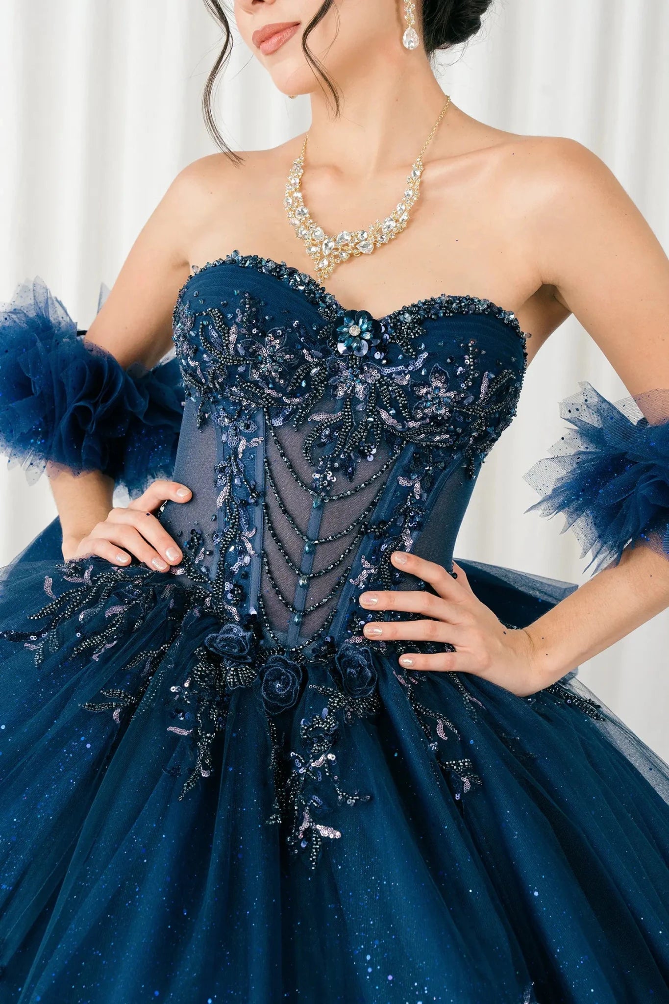 Front full-length comparison view of navy blue mother and daughter matching ball gowns
