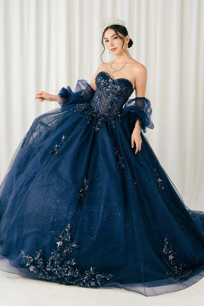 Displayed in a upper-front view, the Navy quinceañera dress has sweetheart embellished bodice and sheer puff sleeves.