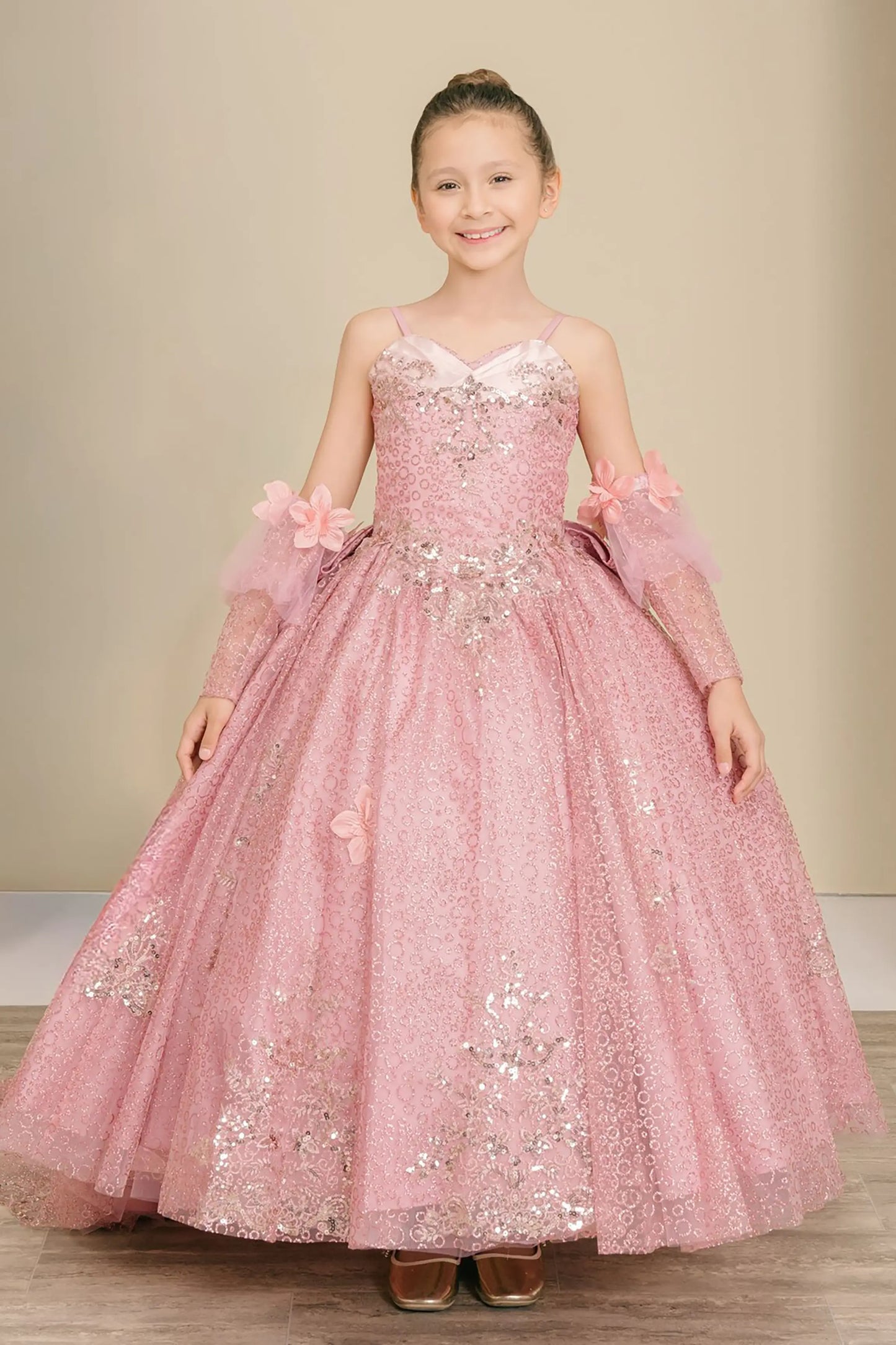 Front full-length view of Dusty Rose mini quince ball gown with glitter floral embroidered bodice, full skirt, lace up back, oversized bow, and sheer lace gloves