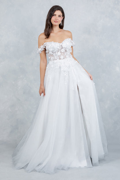 Woman wearing a white strapless gown with floral lace details on a light gray background