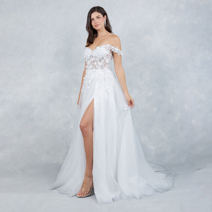 Woman wearing a white off-shoulder gown with lace details on a gray background