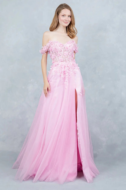 Full front view of a women wearing pink off-shoulder prom dress with floral appliqués and tulle skirt.
