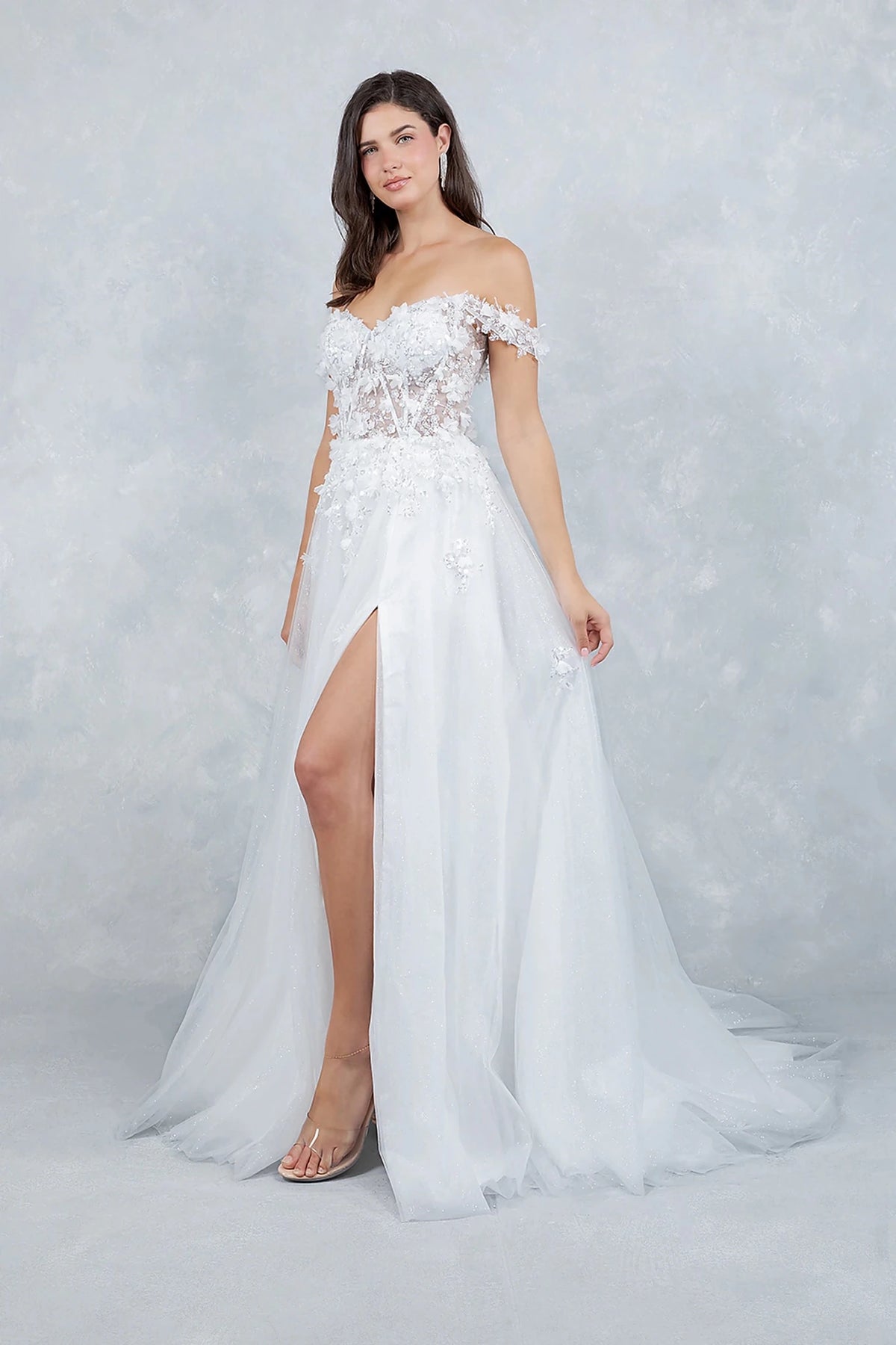 White prom dress showcasing voluminous tulle skirt sparkling with light shimmer effect