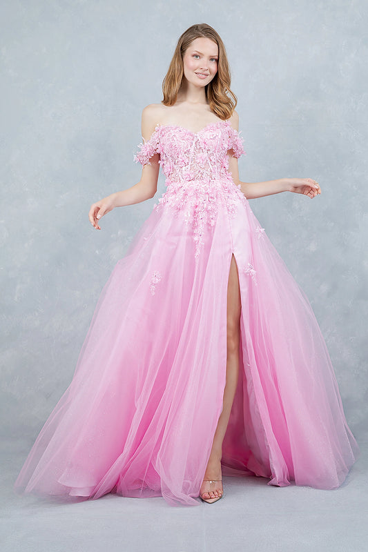 Pink prom dress designed with front slit adding soft movement to flowing silhouette
