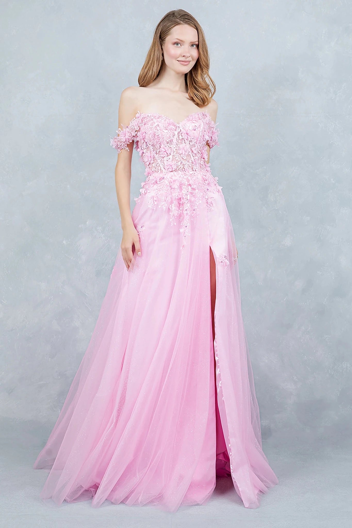 Pink prom dress showcasing voluminous tulle skirt sparkling with light shimmer effect
