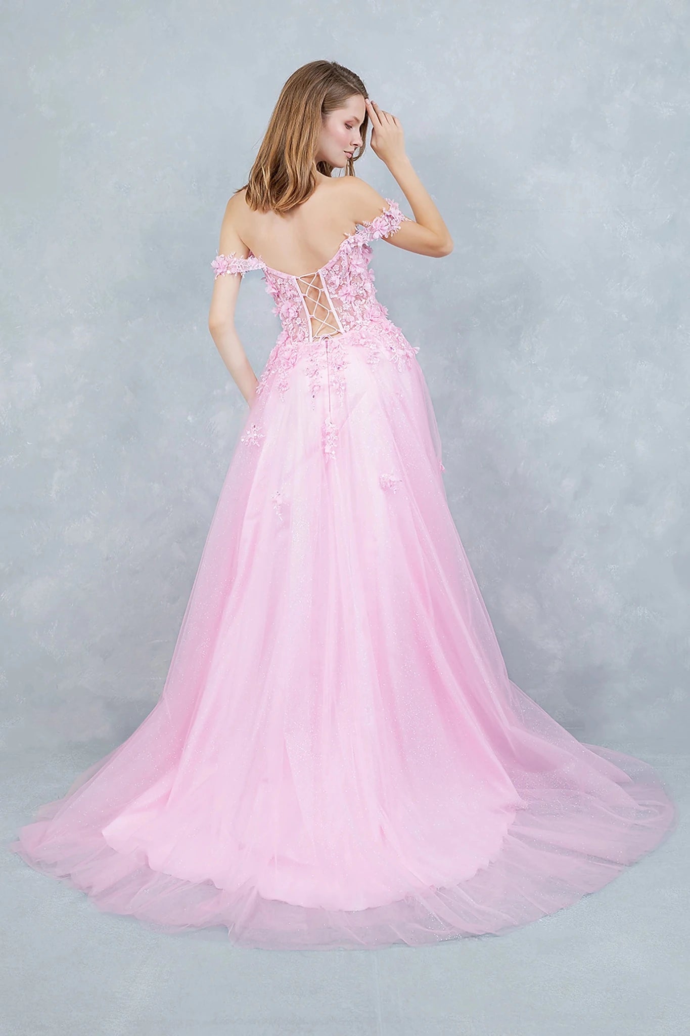 Pink prom dress styled with lace-up back for adjustable flattering fit and fairytale touch