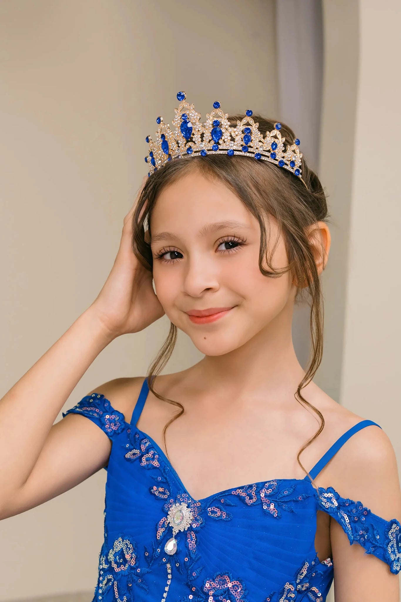 Royal mini quince off-shoulder mini quince dress with an embroidered bodice, gemstone accents, and a layered skirt.